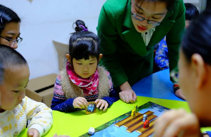 Children participating in hands-on learning activities to develop cognitive skills