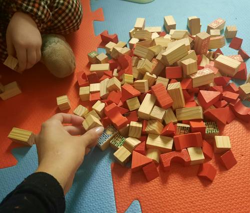 Children or a family collaborating on logic puzzles at a table, representing teamwork, learning, and fun