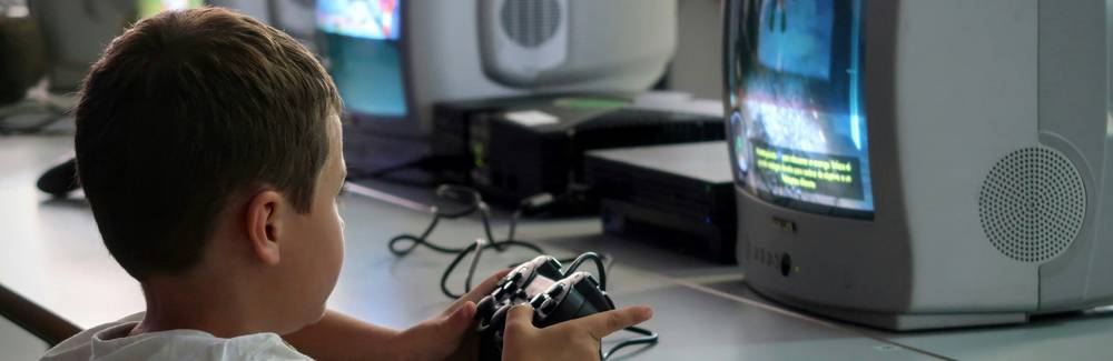 Children engaged in online learning activities in a safe, supervised environment