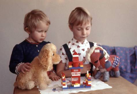 Children or a family working on puzzles, showing focus and collaboration on a table